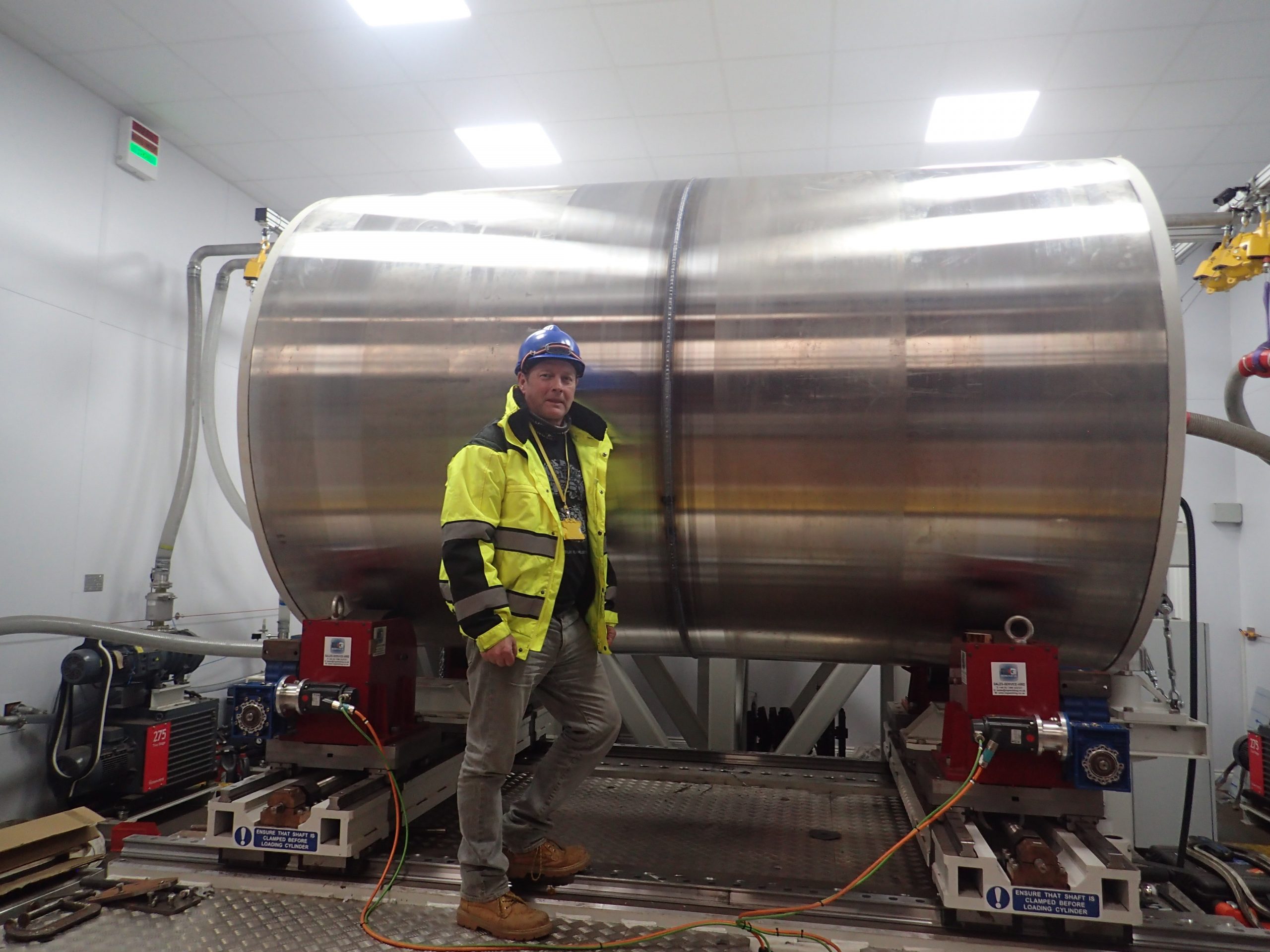 Chris punshon standing in front of a micro modular reactor welded using an ebflow system