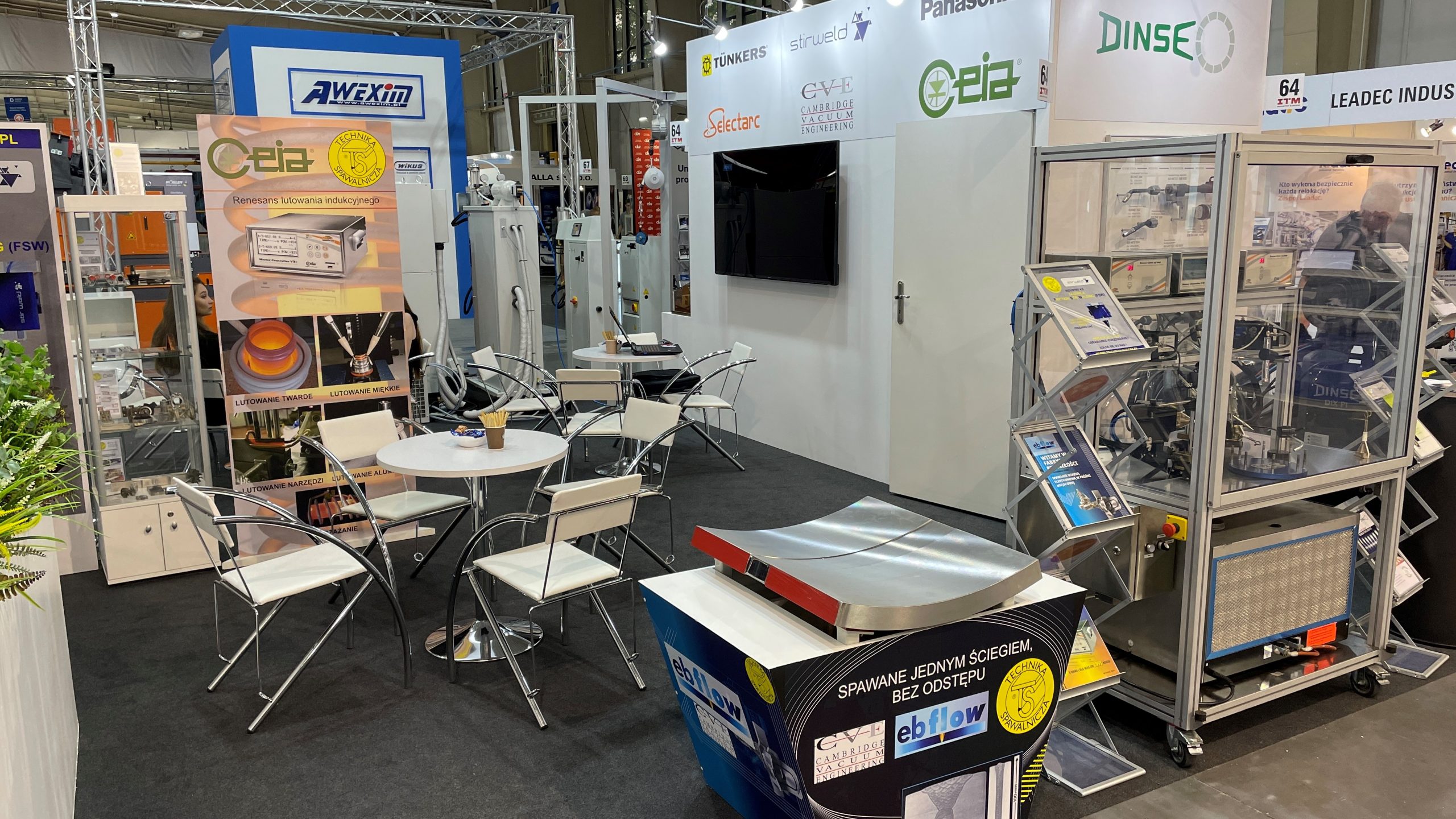 CVE's booth at the ITM Industry Europe welding trade show exhibition showing table and chairs and welded sample